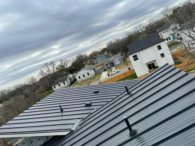 Standing seam metal roof panels with vents for Skylight Repair in Northville
